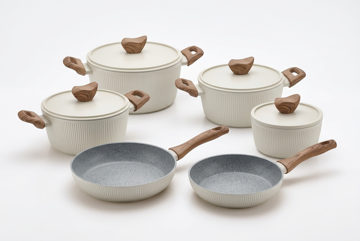 Professional ivory cookware set with four pots, four lids and two frying pans